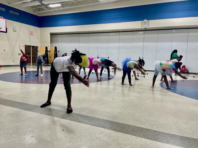 UNC Charlotte student teaches a dance class. 
