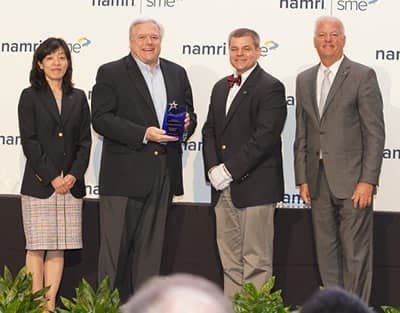 Smith, second left, with Hitomi Yamaguchi, 2018-19 NAMRI/SME president; Thomas Kurfess, 2018 SME president; and Jeffrey Krause, SME executive director and CEO.