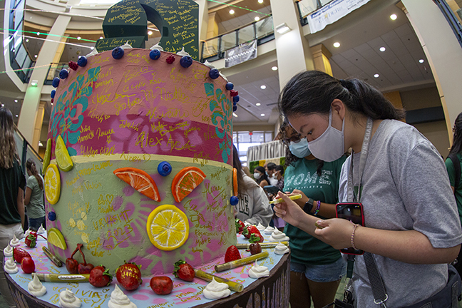 Students, faculty and staff had an opportunity to sign the anniversary cake, designed by students and faculty in the College of Art + Architecture and constructed by the 3D Fabrications Lab, during the 75th Drop-in celebration held at the Popp Martin Student Union