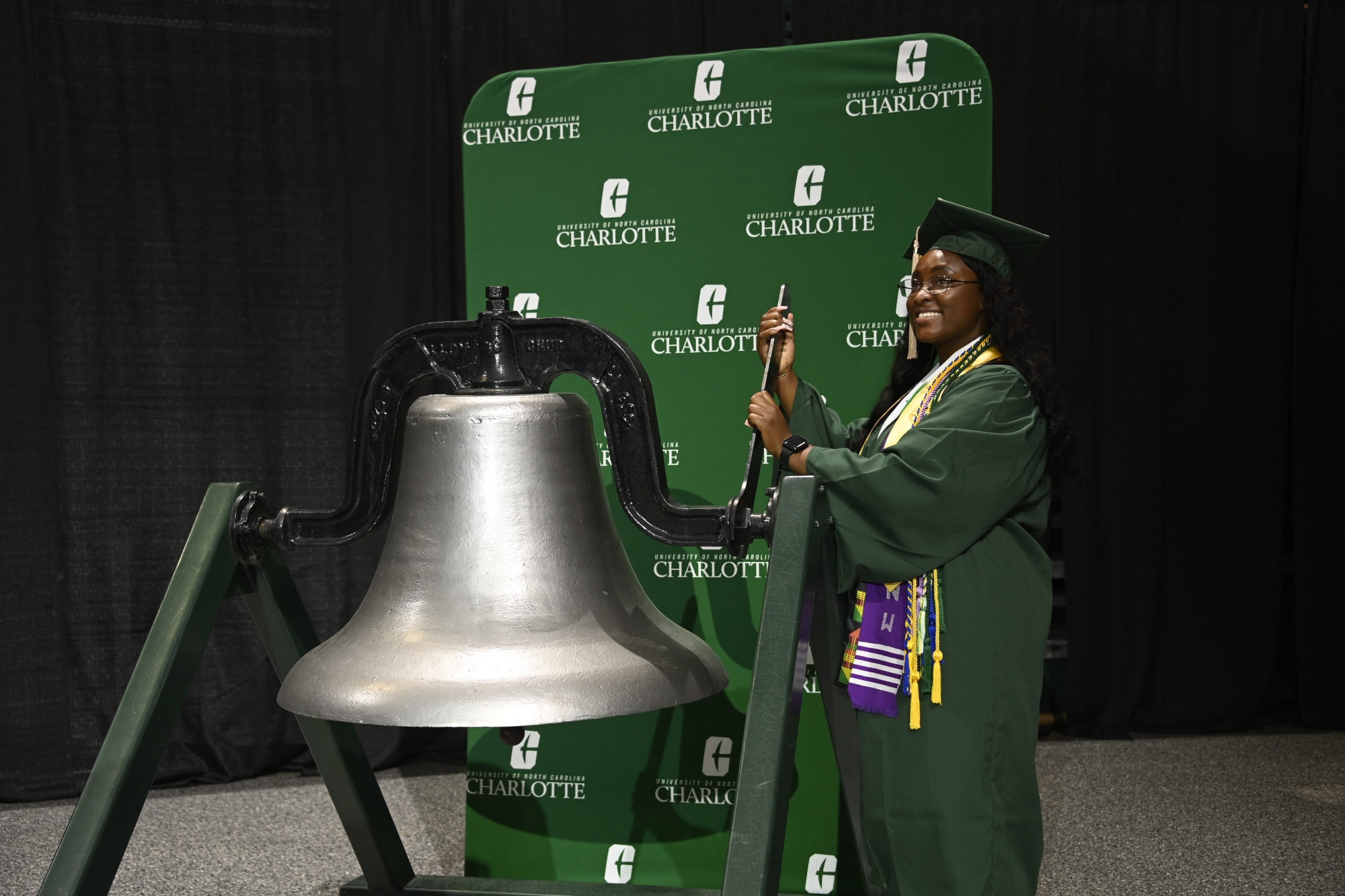 Tiera Tavonna Ray rings the bell during the Saturday afternoon commencement ceremony.