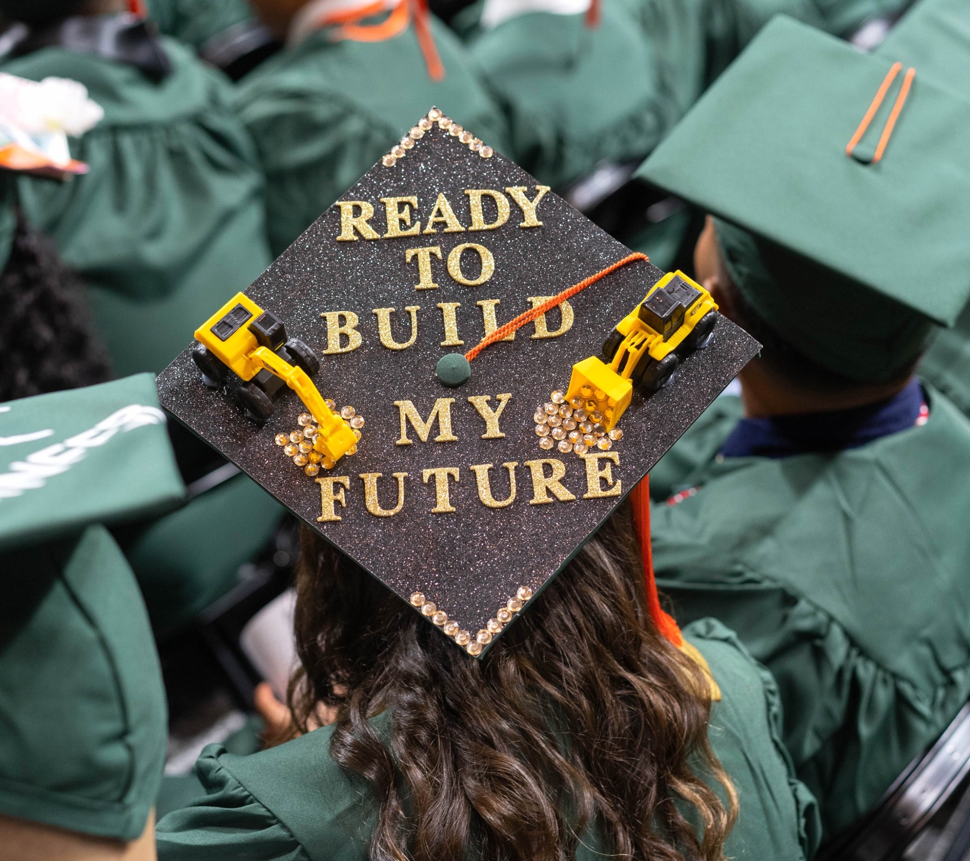 Graduates decorate caps.