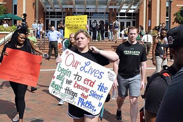Students, faculty and staff participate in a march on campus