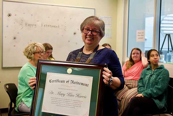A Calling Fulfilled: Math Professor Kim Harris Participates in Her Final Charlotte Commencement