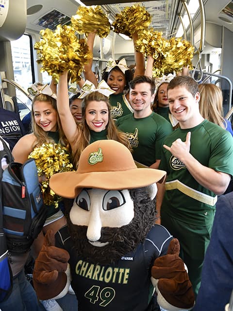 Students and cheerleaders on the LYNX Blue Line inaugural ride