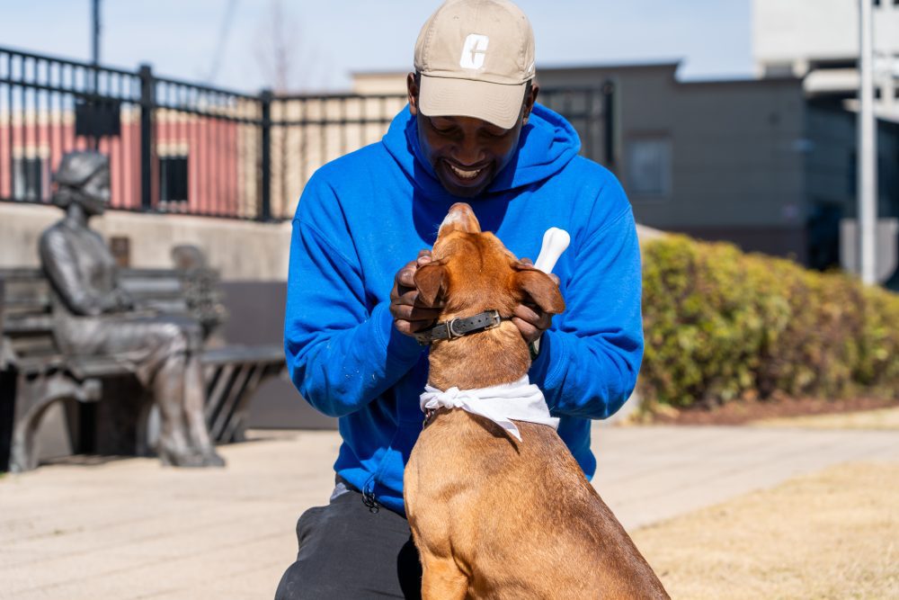 Zacch Estrada-Petersen ’05 with dog