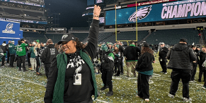 Alumna Kennedy Rodriguez celebrates on field as the Philadelphia Eagles win the NFC Championship