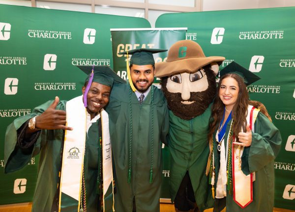 Graduates celebrate with Norm.
