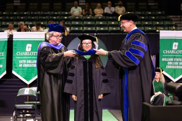 A doctoral student is hooded.