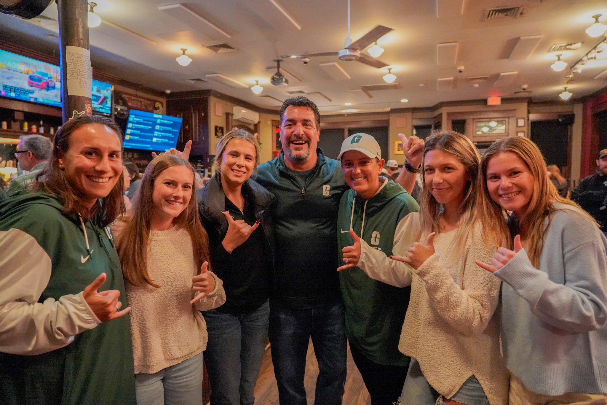 Members of Niner Nation hold picks up at Sammy's Pub for Niner Nation Week social