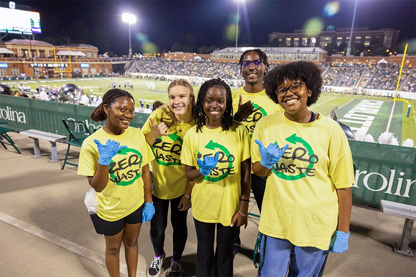 A group of zero-waste stewards at a home football game