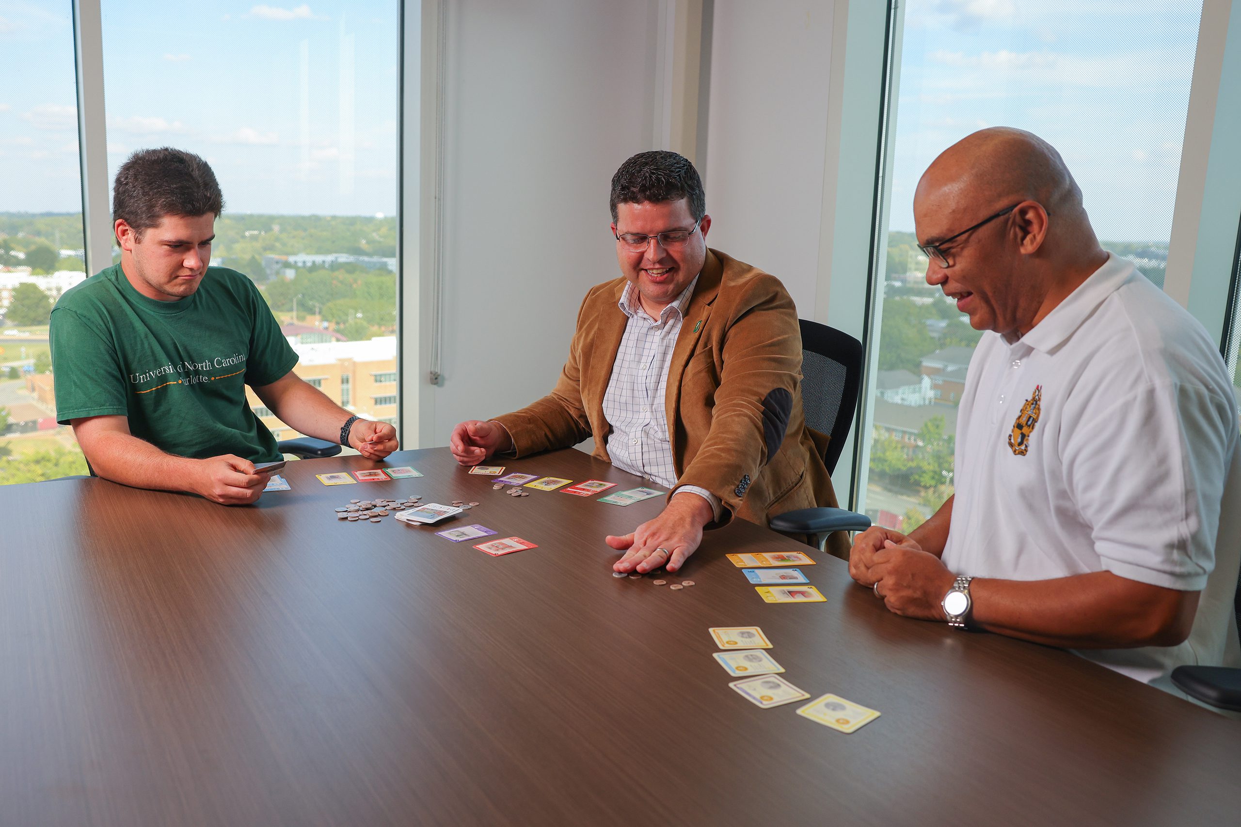 Faculty and Students Playing PLACES Board Game in Office Setting