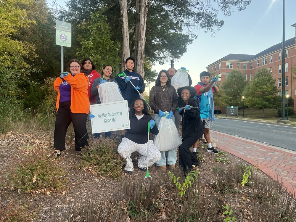 National Residence Hall Honorary poses after cleaning up it's designated spot on campus.