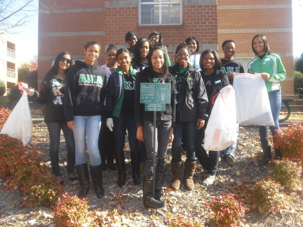 Alpha Kappa Alpha sorority poses after cleaning up it's designated spot on campus (Spring 2009).