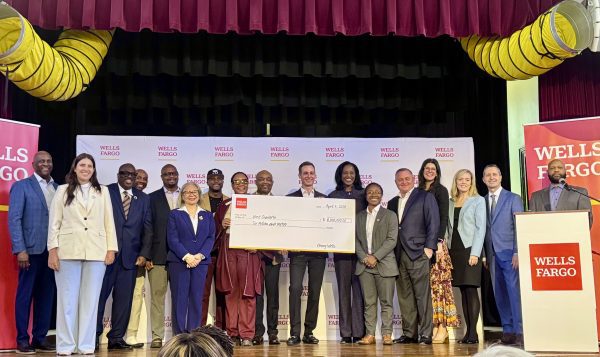 Three Sisters stakeholders receive award from Wells Fargo on stage