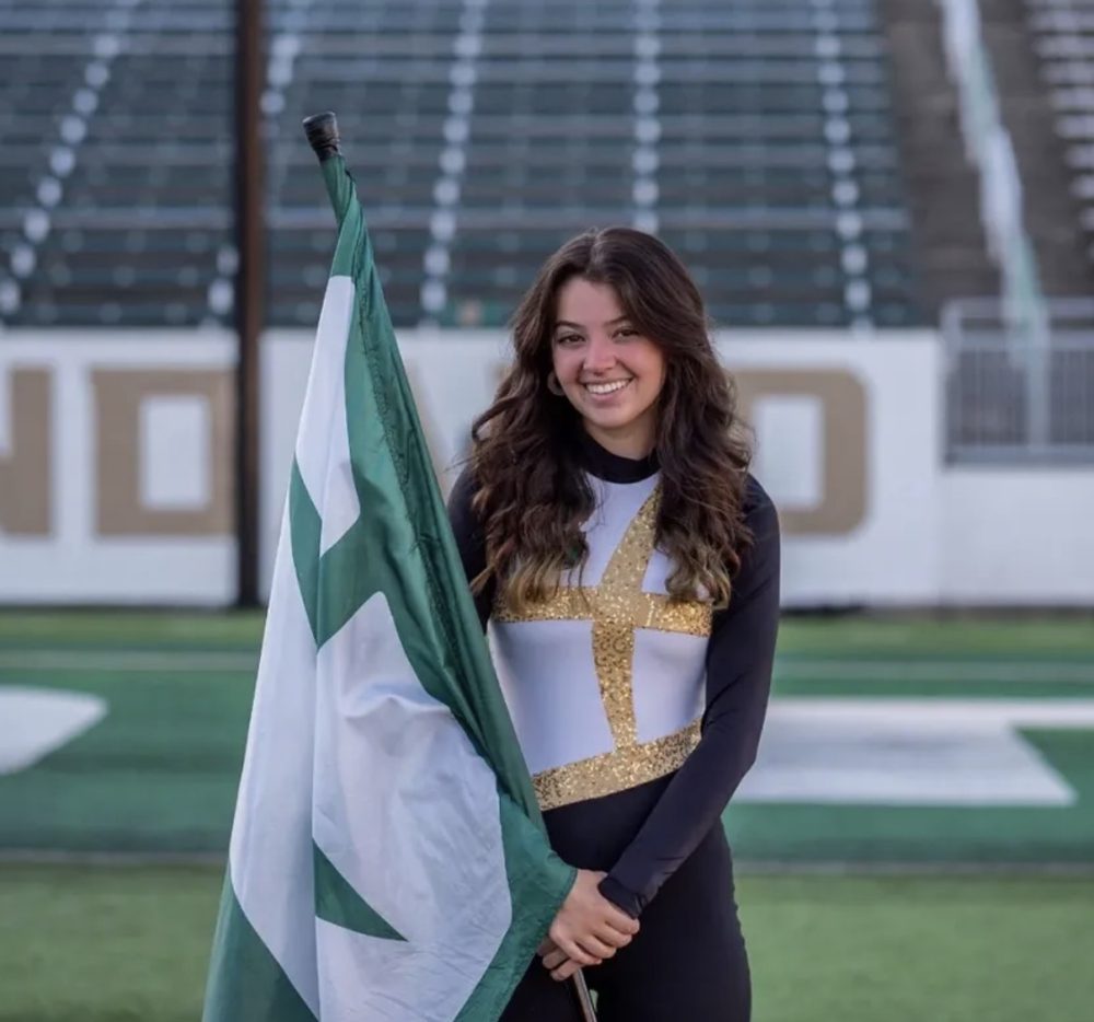 Chase Minor in Pride of Niner Nation marching band uniform