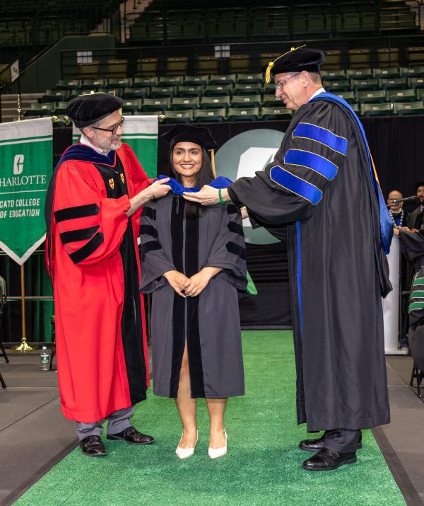 Graduate is hooded during the doctoral hooding ceremony