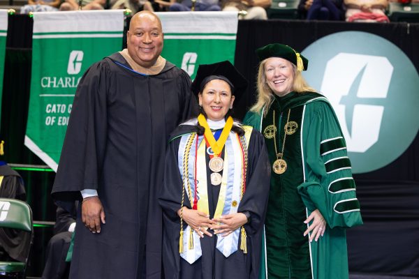 Board of Governor Joel Ford, Susana Cisneros, senior lecturer of Spanish and Chancellor Sharon L. Gaber
