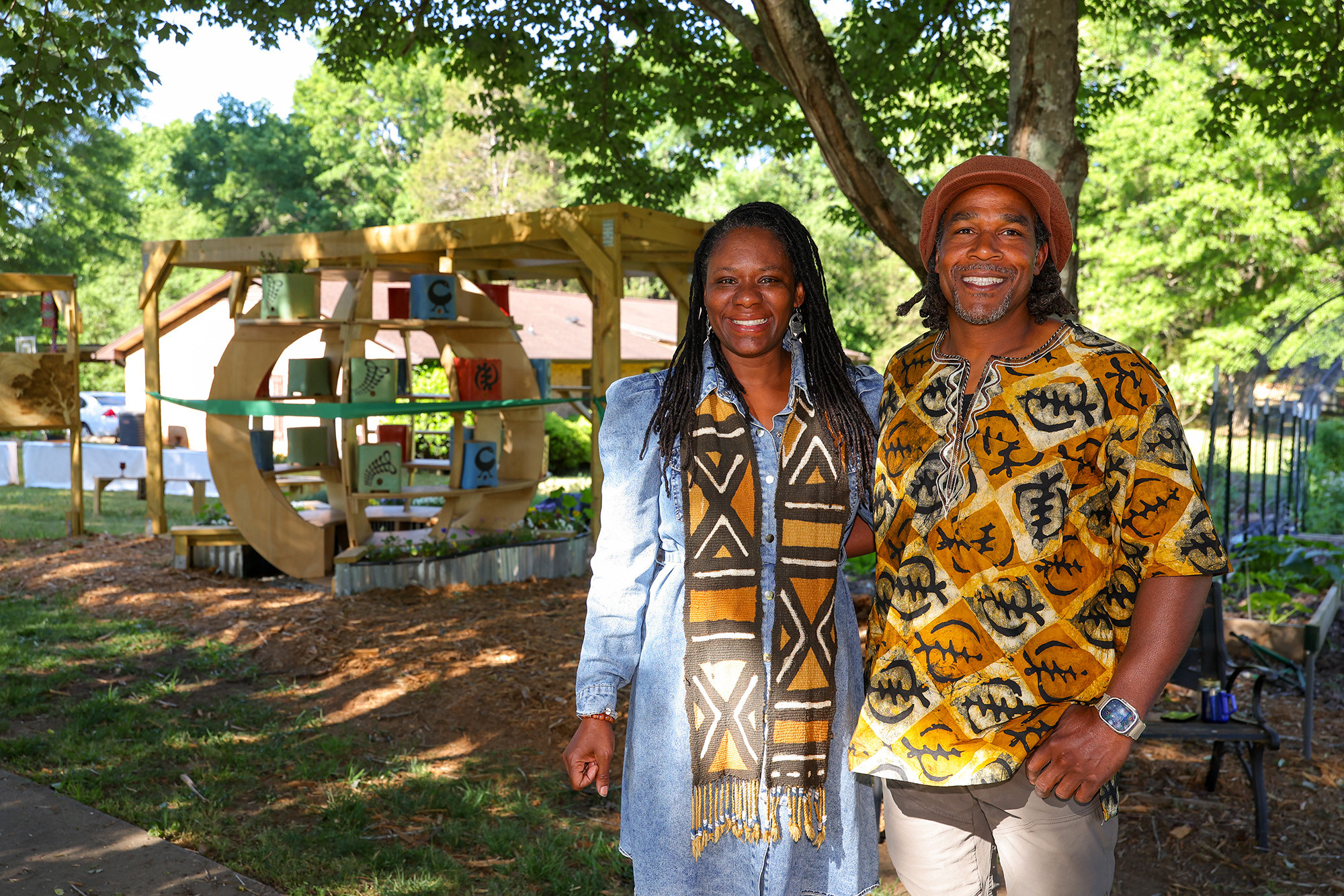 Farmers Banner 2 a couple posing for a picture in a park