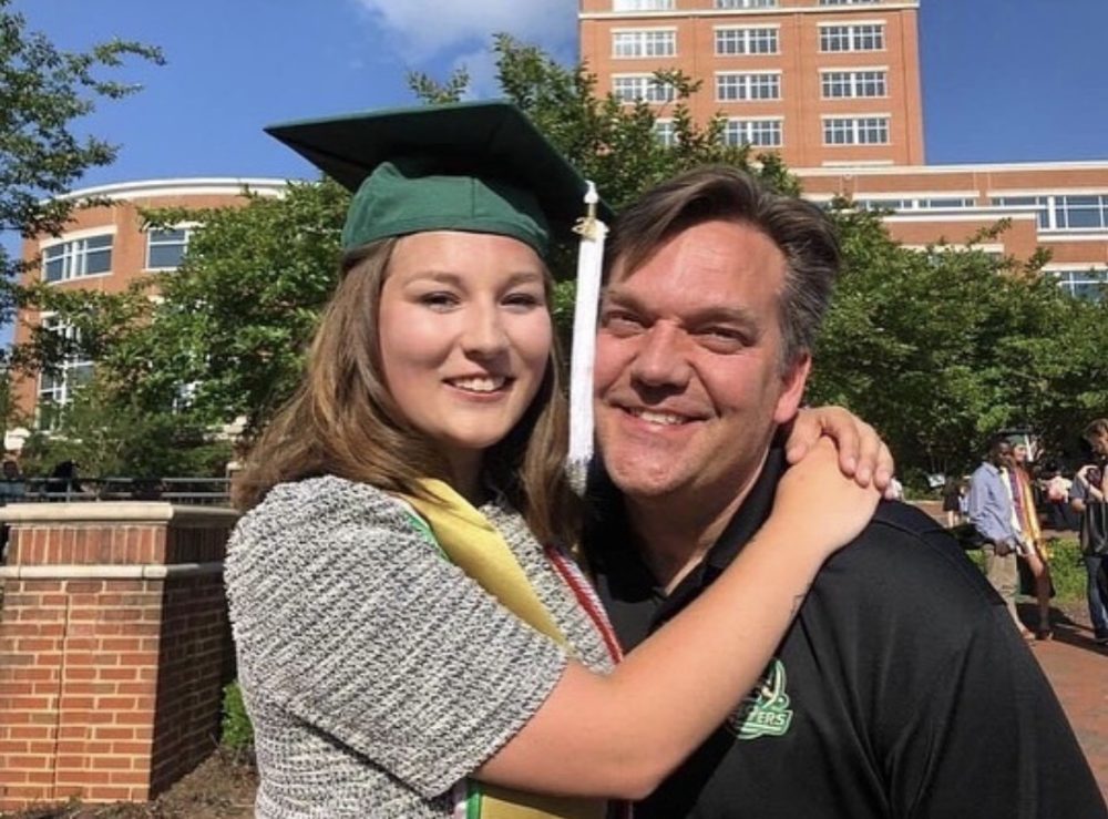 Kenny hugs daughter Madison on her graduation day