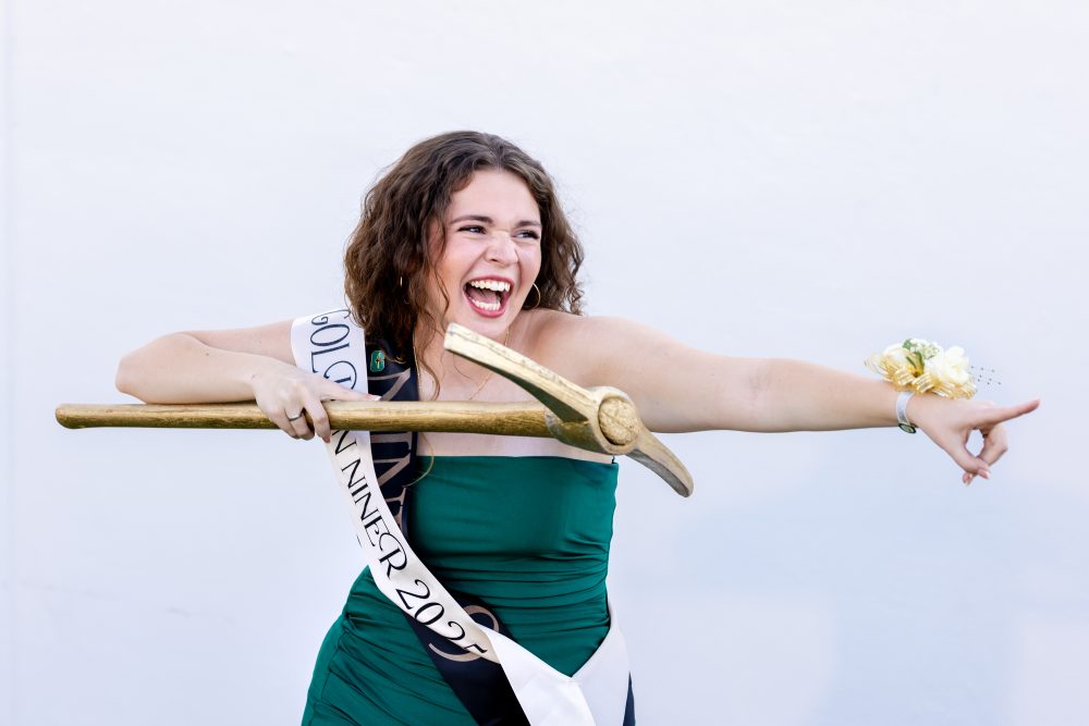 Abby Grace Bare holds golden pickaxe as the reigning Golden Niner