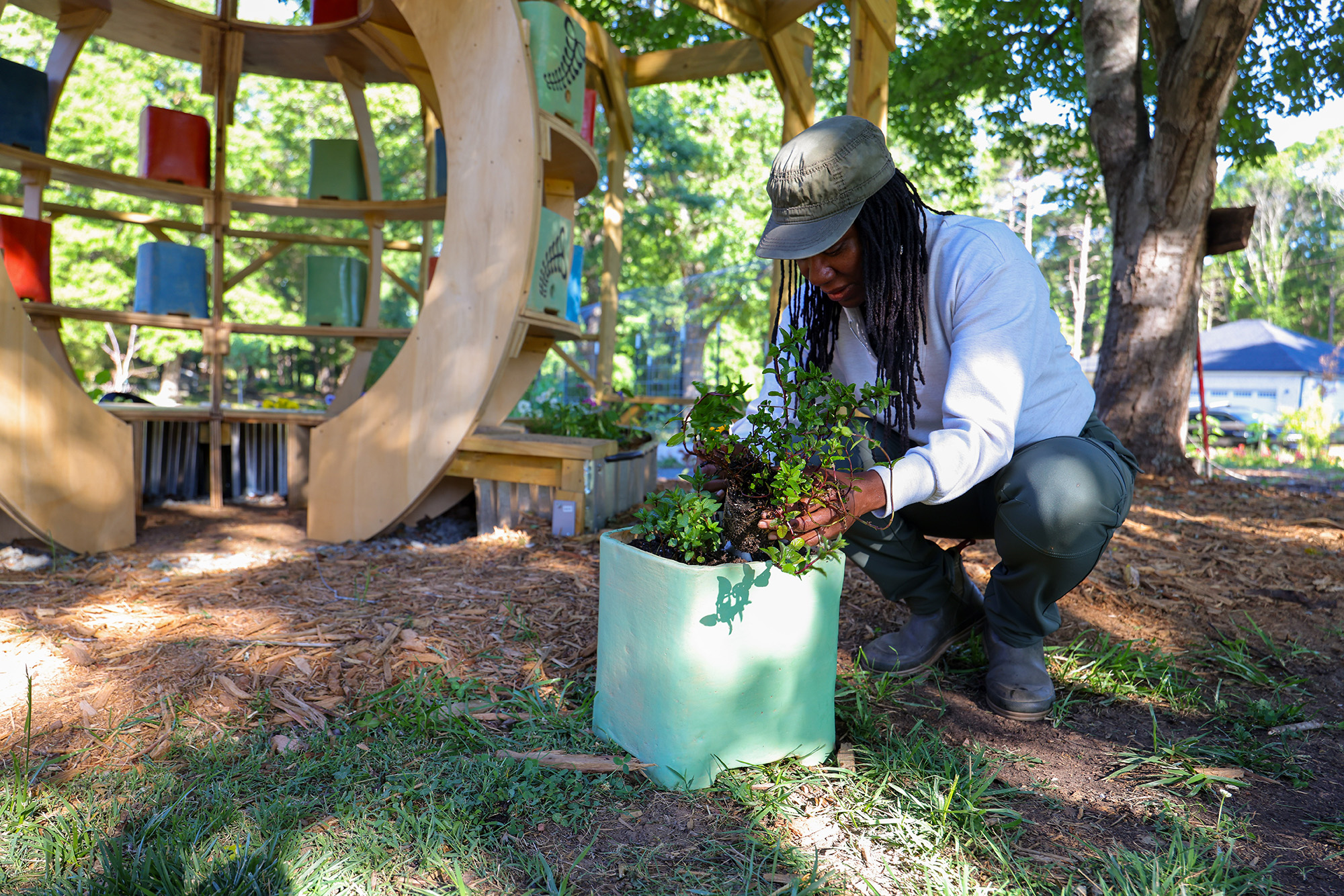 Planter 1 vertical farming structure with custom planter boxes for cultivating herbs