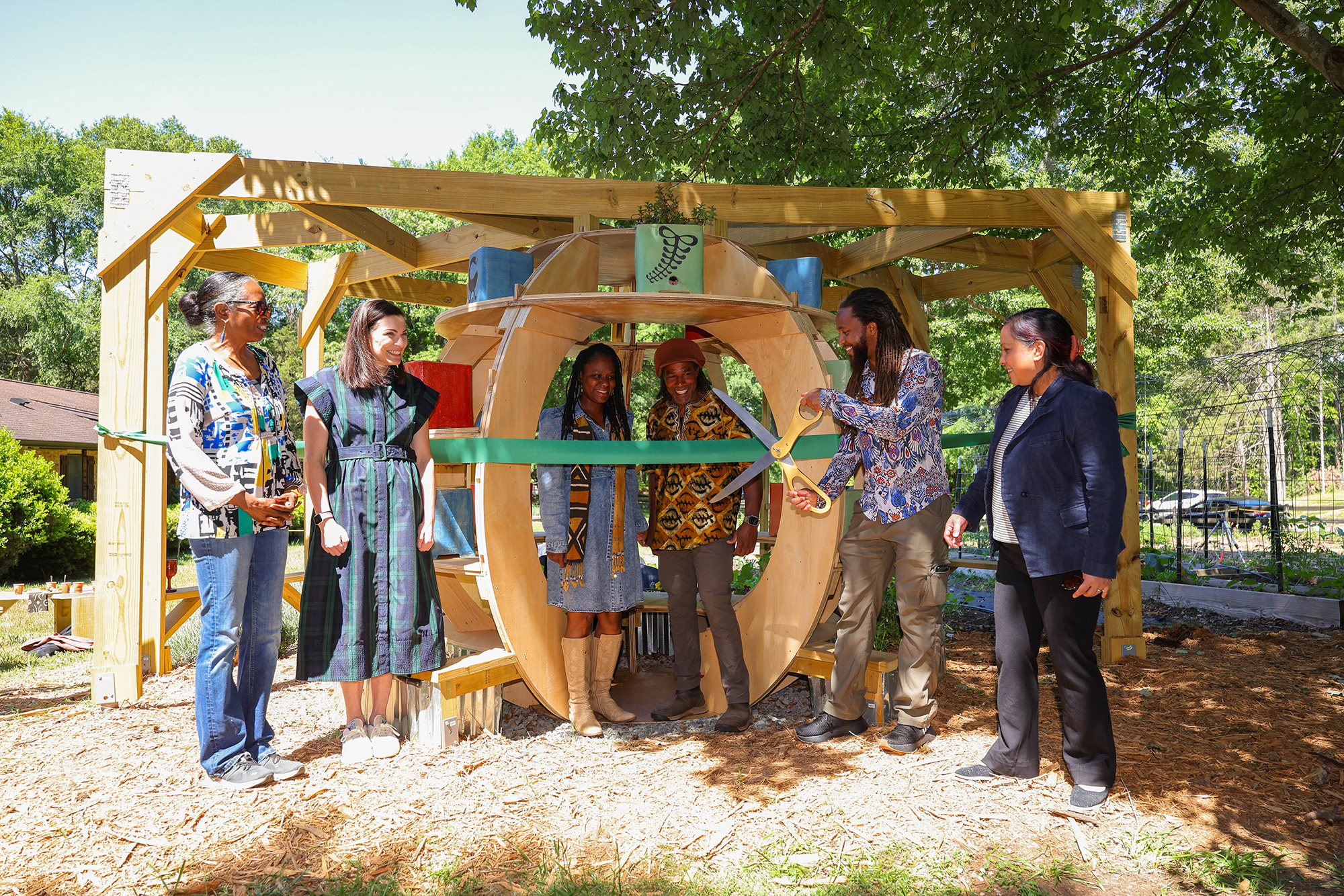 Ribbon Cutting 1 Lydia Thompson, Liz Morrell, Cherie and Wisdom Jzar, Kyle Spence and Cathy Morrison ’06, CEO of Neighboring Concepts, which served as a professional adviser for the project.