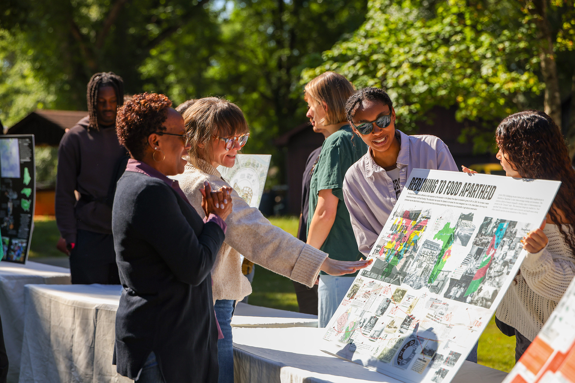 Ribbon Cutting 2 At the ribbon cutting event, students presented research posters investigating issues of urbanization, agricultural decline and food access.