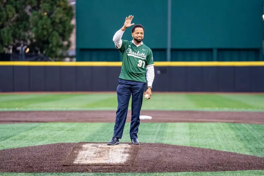 Kevin White waves to crowd standing on the baseball diamond