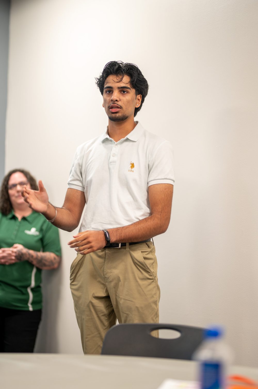Ayush Patel explains his project at the Student AI Fellows showcase
