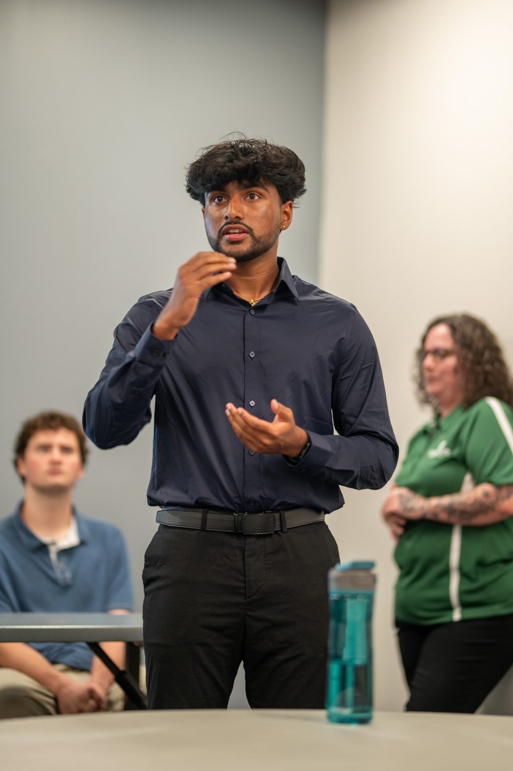 Vasista Vegesana explains his project at the Student AI Fellows showcase