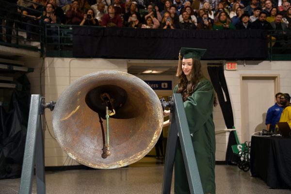 Victory bell being rung at commencement cermony