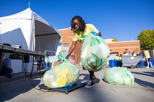 Beth Sanmg sorts trash for the zer-waste inititiave