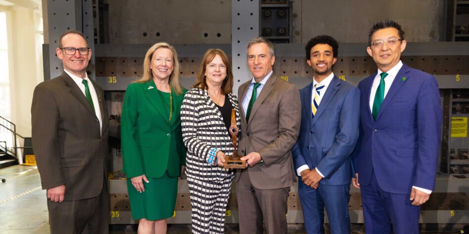 Craig and Darla Albert (center) with Dean Rob Keynton (l to r), Chancellor Sharon Gaber, Albert Scholar Ben Demosthene and Executive Director Lingguang Song