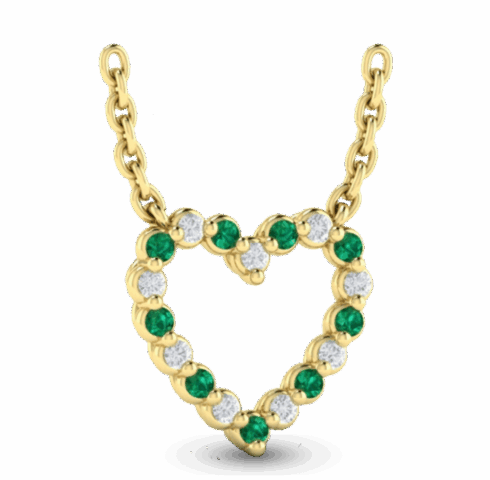 A gold heart-shaped pendant with green emeralds and white diamonds on a chain.
