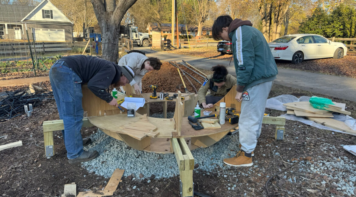 Peterson building art in a park
