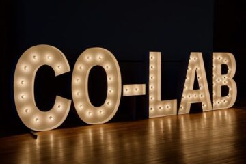 COLAB written out in lights