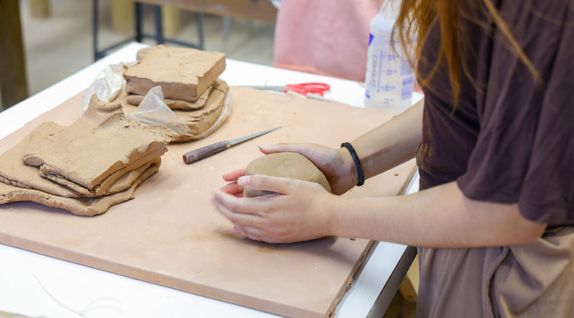 Group of people working with ceramics