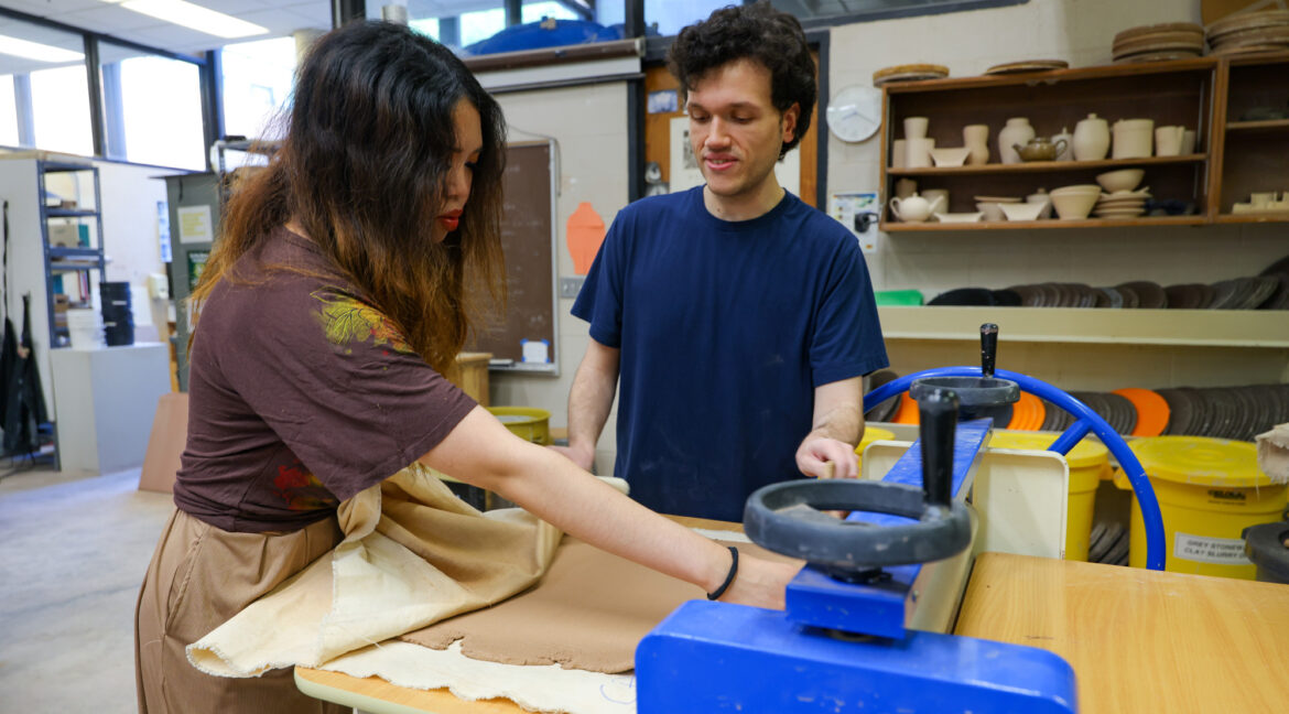 Group of people working with ceramics