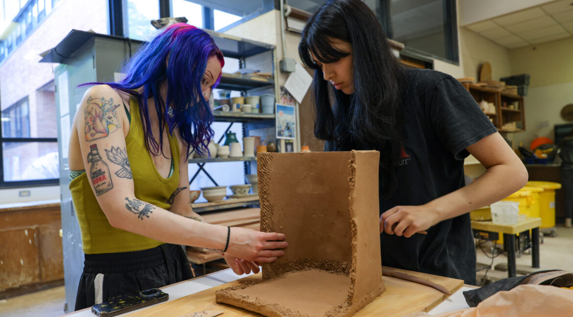 Group of people working with ceramics