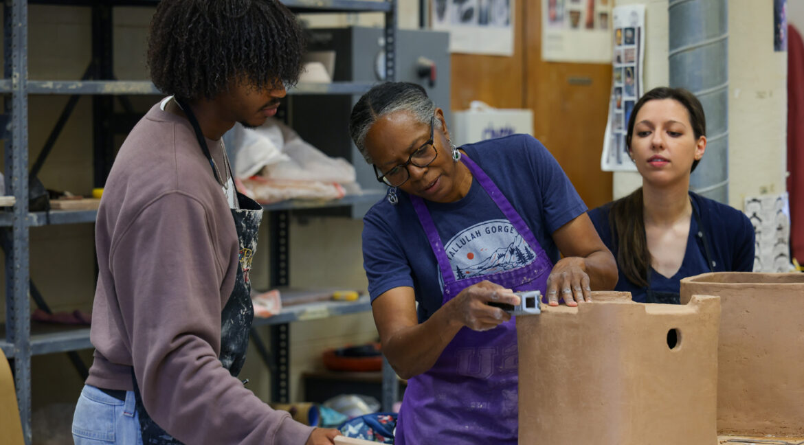 Group of people working with ceramics