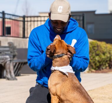 Zacch Estrada-Petersen ’05 with dog