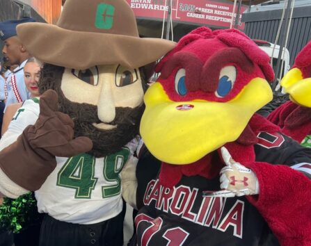Norm the Niner poses with the South Carolina Gamecocks mascot.