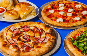King Of Fire Picture of four pizzas on a table