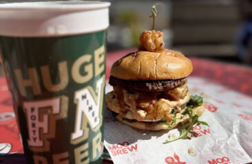 Moo and Brew picture of a burger and drink on a table