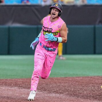 Reece Hampton, The Party Animals A baseball player in a bright pink “Party Animals” uniform runs across the field, shouting with excitement during a game.