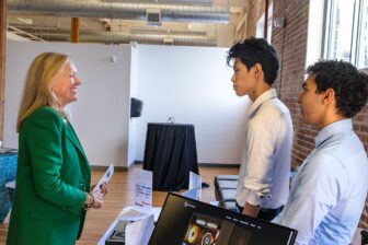 Ren Zehn talking with Chancellor