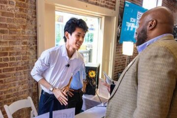 Ren Zhen talking to a customer