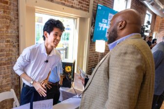 Ren Zhen talking with customer