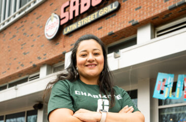 Sabor Owner of Sabor Latin Street Grill posing outside of restaurant