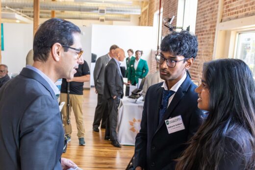 Siddarth Gaddam and Meghan Asaati talking with customers